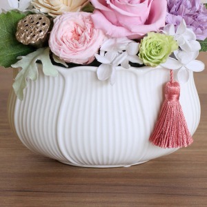 �_�炩�ȃJ�[�u��`����������g���A�s���N�̃^�b�Z����Y���܂����B